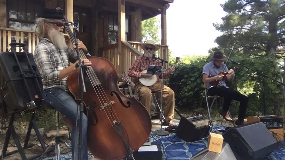 3hattrio performing for the Albuquerque Folk Festival with their award proudly on display